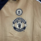 Camisa Dupla Face Retrô Manchester United 2001/02 100 Anos Masculina Branca e Preta ou Dourada