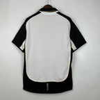 Camisa Dupla Face Retrô Manchester United 2001/02 100 Anos Masculina Branca e Preta ou Dourada
